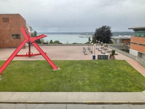 View from outside 377 window. Lawn outside PAC, the large For Handel statue is visible. The bay is in the distance.