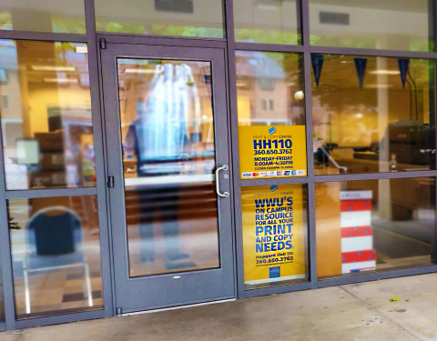 Glass door with a wall of various sized rectangular windows. Signage to right of door; HH110. WWU's on campus resource for all your print and copy needs.